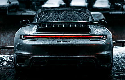 Snow-kissed elegance: Porsche Turbo S standing strong in the cold.'