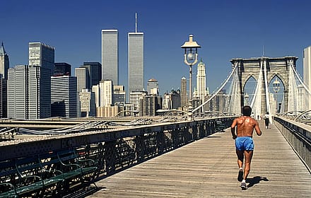 Taking a jog on Brooklyn Bridge with Twin Towers by Dino Fracchia, 1985'