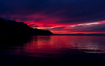 Crimson Sunset Over Water'