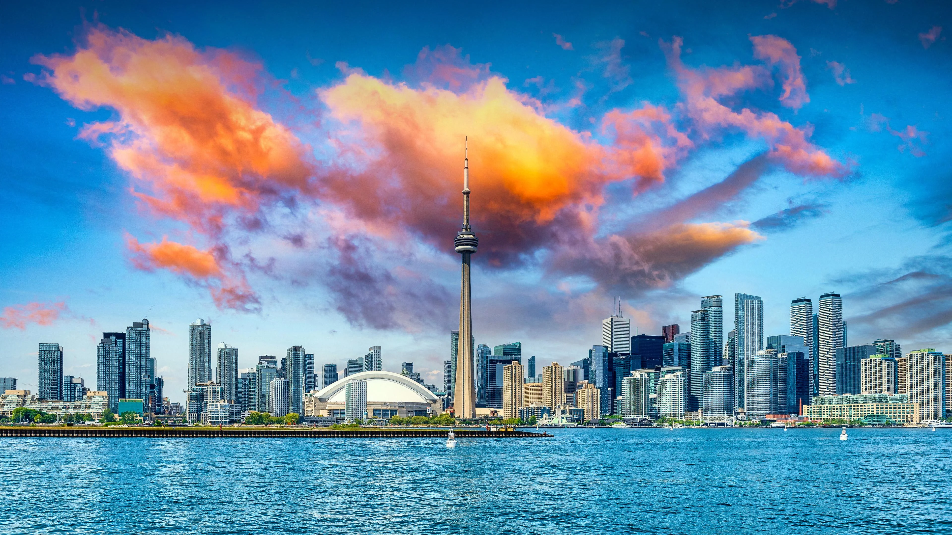 Golden Hour Over Toronto The Skyline Glowing Under Painted Skies Wallpaper picture 1 of 1